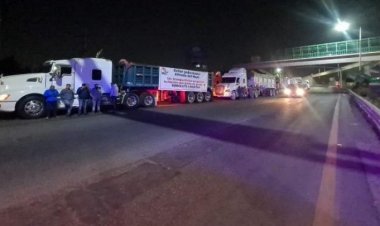 Transportistas bloquean la México-Pirámides; exigen cese de extorsiones